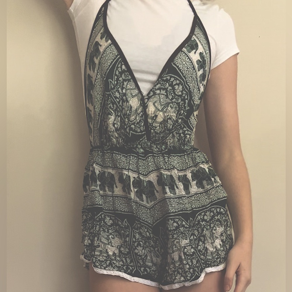 Green and white romper. Elephant patterned. Flowy material size small